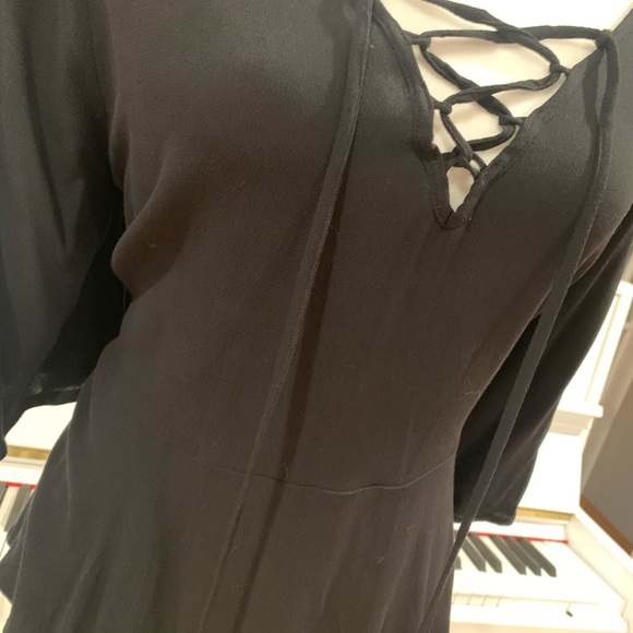 Black flowy peplum style lattice top - Picture 4 of 4